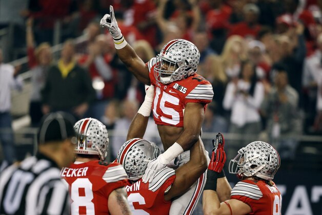 Ohio State's Ezekiel Elliott celebrates his touchdown run during the first half of the NCAA college football playoff championship game against Oregon Monday, Jan. 12, 2015, in Arlington, Texas. (AP Photo/Brandon Wade)