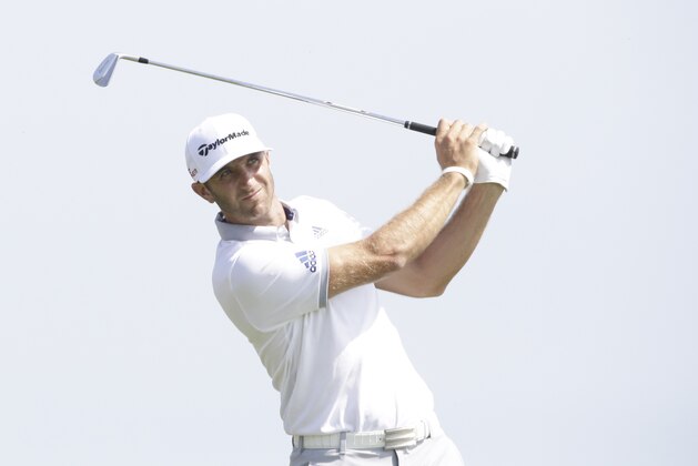 Dustin Johnson hits a shot on the third hole during the first round of the PGA Championship golf tournament Thursday, Aug. 13, 2015, at Whistling Straits in Haven, Wis. (AP Photo/Brynn Anderson)