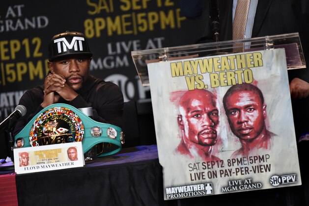 Boxer Floyd 'Money' Mayweather during a press conference to officially announce his September 12 fight against Andre Berto that will place at the MGM Grand Garden Arena in Las Vegas, at the Marriott Hotel in Los Angeles, California on August 6, 2015.  Mayweather claims it will be the last ever opportunity to see him fight.          AFP PHOTO / MARK RALSTON        (Photo credit should read MARK RALSTON/AFP/Getty Images)