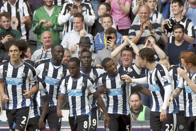 Newcastle United's Georginio Wijnaldum, center, celebrates his goal with his teammates during their English Premier League soccer match between Newcastle United and Southampton at St James' Park, Newcastle, England, Sunday, Aug. 9, 2015. (AP Photo/Scott Heppell)