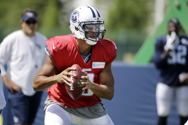 Tennessee Titans quarterback Marcus Mariota runs a play during NFL football training camp Tuesday, Aug. 11, 2015, in Nashville, Tenn. (AP Photo/Mark Humphrey)