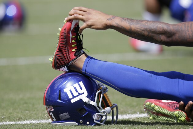 New York Giants wide receiver Odell Beckham Jr. warms up during a joint NFL football training camp with the Cincinnati Bengals, Wednesday, Aug. 12, 2015, in Cincinnati. (AP Photo/John Minchillo)