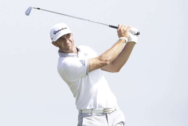 Dustin Johnson hits a shot on the third hole during the first round of the PGA Championship golf tournament Thursday, Aug. 13, 2015, at Whistling Straits in Haven, Wis. (AP Photo/Brynn Anderson)