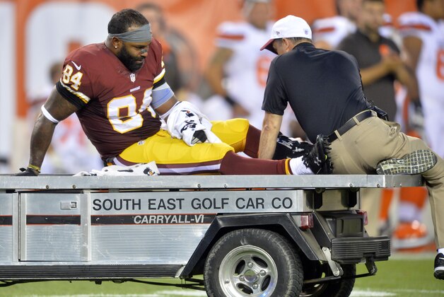 Washington Redskins tight end Niles Paul (84) leaves the game in the first quarter after an injury during an NFL preseason football game against the Cleveland Browns, Thursday, Aug. 13, 2015, in Cleveland. (AP Photo/David Richard)