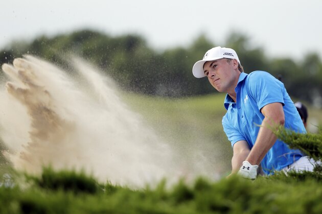 Jordan Spieth hits out of a bunker on the 15th hole during the first round of the PGA Championship golf tournament Thursday, Aug. 13, 2015, at Whistling Straits in Haven, Wis. (AP Photo/Jae Hong)