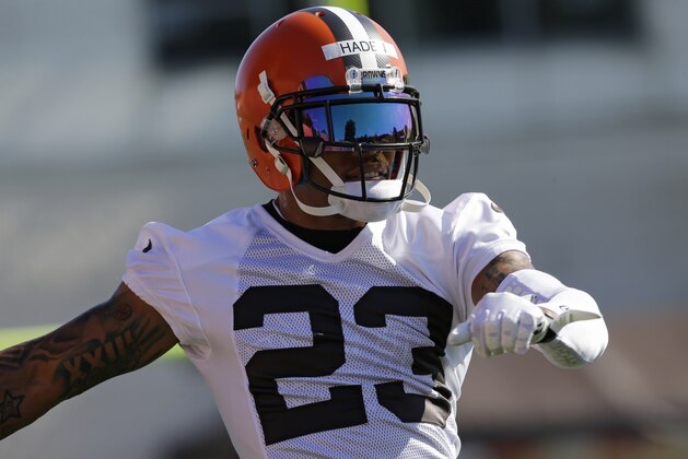 Cleveland Browns cornerback Joe Haden stretches during practice at the NFL football team's training camp Thursday, July 30, 2015, in Berea, Ohio. (AP Photo/Tony Dejak)