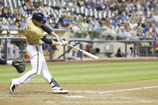 Milwaukee Brewers' Ryan Braun hits a double during the eighth inning of a baseball game against the San Diego Padres Wednesday, Aug. 5, 2015, in Milwaukee. (AP Photo/Morry Gash)