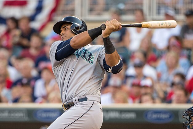 Aug 1, 2015; Minneapolis, MN, USA; Seattle Mariners right fielder Nelson Cruz (23) hits a ground rule double in the first inning against the Minnesota Twins at Target Field. Mandatory Credit: Jesse Johnson-USA TODAY Sports