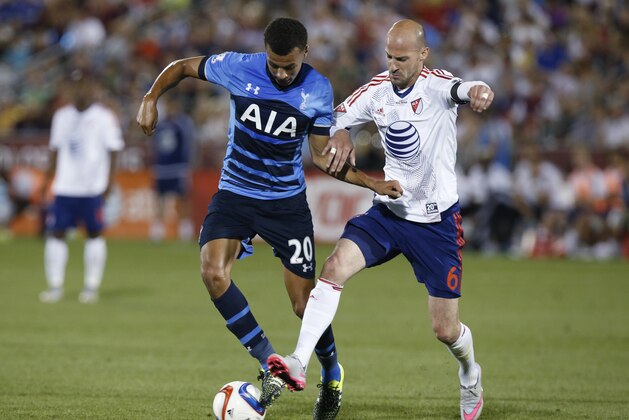 Tottenham Hotspurs midfielder Dele Alli, left, battles for control of the ball with MLS All-Star defender Laurent Ciman during the second half of the MLS All-Star soccer game Wednesday, July 29, 2015, in Commerce City, Colo. The MLS All-Stars won 2-1, in the 20th annual mid-season classic for the league. (AP Photo/David Zalubowski)