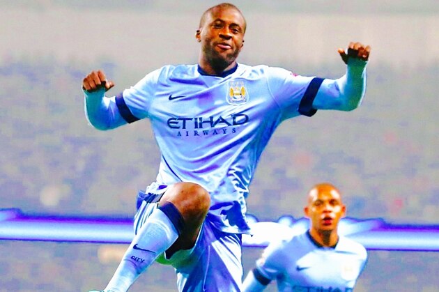 Manchester City's Yaya Toure, centre,  reacts after scoring his side's first goal, during the Champions League group E soccer match between Manchester City and CSKA Moscow, at the Etihad Stadium, in Manchester, England, Wednesday, Nov. 5, 2014. (AP Photo/Jon Super)