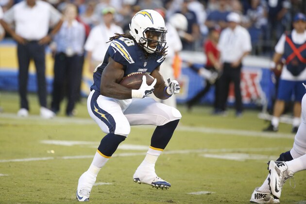San Diego Chargers running back Melvin Gordon runs with the ball against the Dallas Cowboys during the first half of an NFL preseason football game Thursday, Aug. 13, 2015 in San Diego. (AP Photo/Lenny Ignelzi)