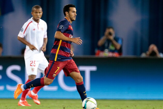 Barcelona's Pedro Rodriguez runs with the ball during the UEFA Super Cup soccer match between FC Barcelona and Sevilla FC at the Boris Paichadze Dinamo Arena stadium, in Tbilisi, Georgia, on Wednesday, Aug. 12, 2015. (AP Photo/Ivan Sekretarev)