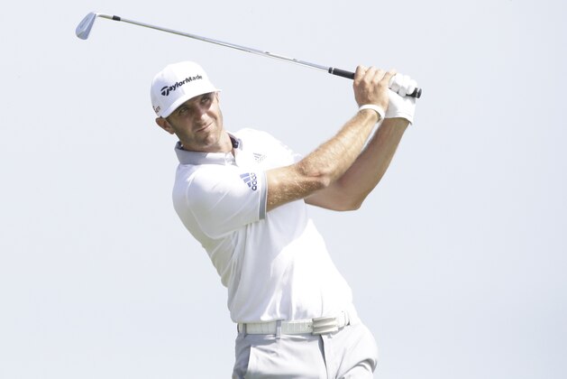 Dustin Johnson hits a shot on the third hole during the first round of the PGA Championship golf tournament Thursday, Aug. 13, 2015, at Whistling Straits in Haven, Wis. (AP Photo/Brynn Anderson)