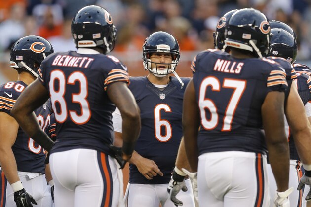Chicago Bears quarterback Jay Cutler (6) huddles with his team during the first half of an NFL preseason football game against the Miami Dolphins in Chicago, Thursday, Aug. 13, 2015. (AP Photo/Charles Rex Arbogast)
