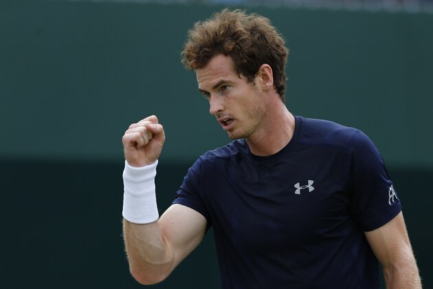 Britain's Andy Murray reacts during a Davis Cup world group quarter-finals singles tennis match against France's Gilles Simon at the Queen's Club in west London on July 19, 2015.  AFP PHOTO / JUSTIN TALLIS        (Photo credit should read JUSTIN TALLIS/AFP/Getty Images)
