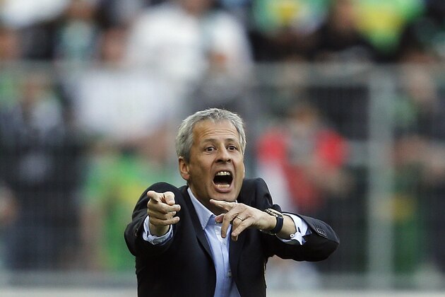 Moenchengladbach's head coach Lucien Favre gestures during the German first division Bundesliga soccer match between Borussia Moenchengladbach and TSG Hoffenheim in Moenchengladbach, Germany, Sunday, Nov. 2, 2014. (AP Photo/Frank Augstein)