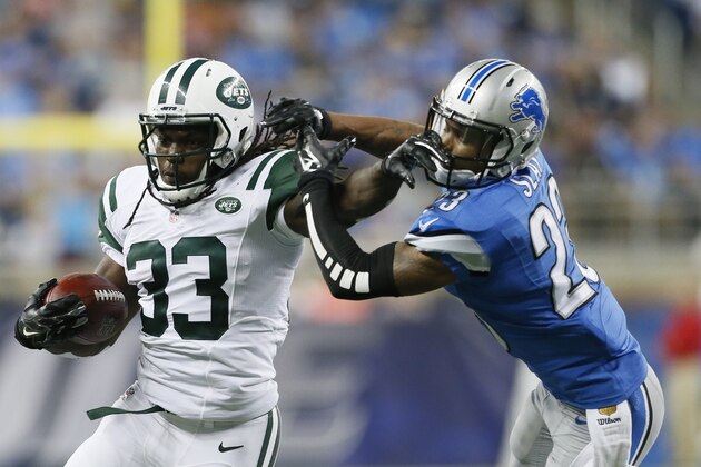 New York Jets running back Chris Ivory (33) stiff arms Detroit Lions cornerback Darius Slay (23) during the first half of an NFL preseason football game, Thursday, Aug. 13, 2015, in Detroit. (AP Photo/Rick Osentoski)