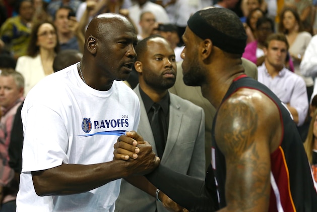 CHARLOTTE, NC - APRIL 28:  LeBron James #6 of the Miami Heat hugs Michael Jordan after defeating the Charlotte Bobcats 109-98 in Game Four of the Eastern Conference Quarterfinals during the 2014 NBA Playoffs at Time Warner Cable Arena on April 28, 2014 in Charlotte, North Carolina. NOTE TO USER: User expressly acknowledges and agrees that, by downloading and or using this photograph, User is consenting to the terms and conditions of the Getty Images License Agreement.  (Photo by Streeter Lecka/Getty Images)