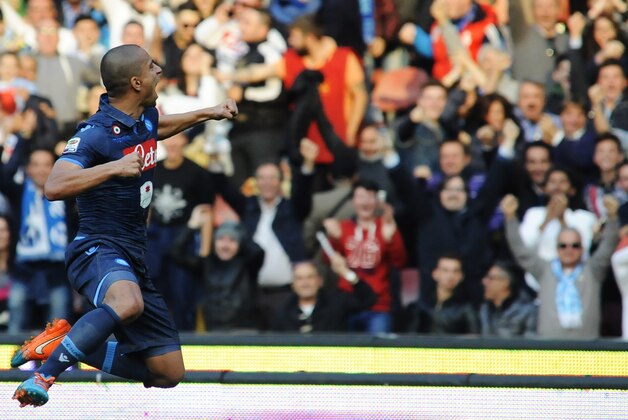 Napoli's Gokhan Inler celebrates after scoring during a Serie A soccer match between Napoli and Cagliari, at the San Paolo stadium in Naples, Italy, Sunday, Nov. 23, 2014. (AP Photo/Salvatore Laporta)
