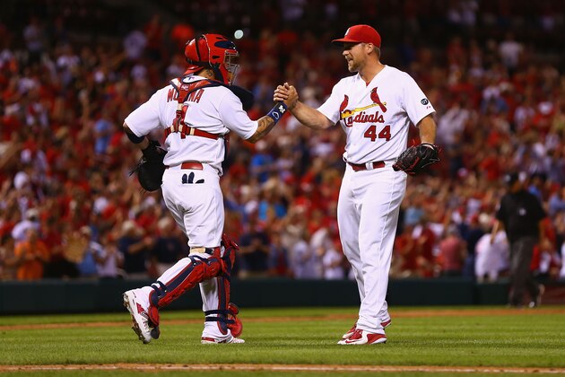 ST. LOUIS, MO - AUGUST 11: Yadier Molina #4 and Trevor Rosenthal #44 of the St. Louis Cardinals celebrate after beating the Pittsburgh Pirates at Busch Stadium on August 11, 2015 in St. Louis, Missouri.  (Photo by Dilip Vishwanat/Getty Images)