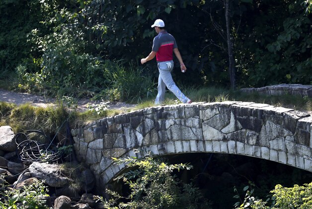 Rory McIlroy, of Northern Ireland, makes his way to the first hole during the second round of the PGA Championship golf tournament Friday, Aug. 14, 2015, at Whistling Straits in Haven, Wis. (AP Photo/Julio Cortez)