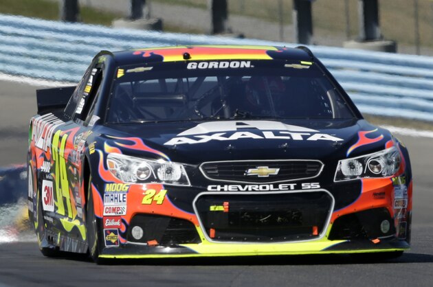 Jeff Gordon (24) leads a group of racers through the esses during a NASCAR Sprint Cup series auto race at Watkins Glen International, Sunday, Aug. 9, 2015, in Watkins Glen, N.Y. (AP Photo/Mel Evans)