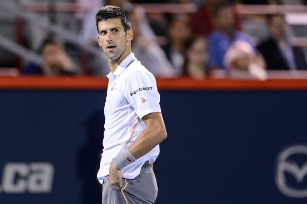 MONTREAL, ON - AUGUST 14:  Novak Djokovic of Serbia looks on in his match against Ernests Gulbis of Latvia during day five of the Rogers Cup at Uniprix Stadium on August 14, 2015 in Montreal, Quebec, Canada.  Novak Djokovic defeated Ernests Gulbis 5-7, 7-6, 6-1.  (Photo by Minas Panagiotakis/Getty Images)