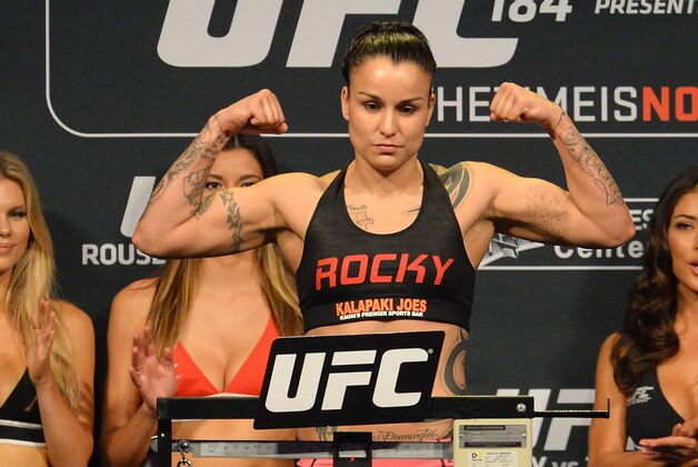 Feb 27, 2015; Los Angeles, CA, USA;  Raquel Pennington on the scale at the weigh-in for UFC 184 at Staples Center. Mandatory Credit: Jayne Kamin-Oncea-USA TODAY Sports