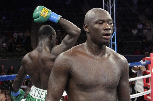 Antonio Tarver, center, walks away from Lateef Kayode, of Nigeria, after their cruiserweight boxing match in Carson, Calif., Saturday, June 2, 2012. The fight ended in a draw. (AP Photo/Jae C. Hong)