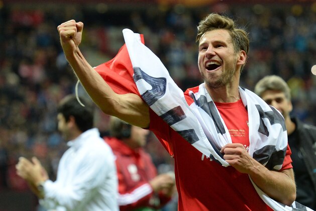 Sevilla's Polish midfielder Grzegorz Krychowiak celebratesafter the UEFA Europa League final football match between FC Dnipro Dnipropetrovsk and Sevilla FC at the Narodowy stadium in Warsaw, Poland on May 27, 2015. Sevilla FC won 2-3.   AFP PHOTO / PIOTR HAWALEJ        (Photo credit should read PIOTR HAWALEJ/AFP/Getty Images)