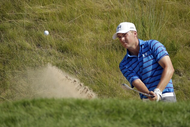 Jordan Spieth hits from a bunker on the 18th hole during the second round of the PGA Championship golf tournament Friday, Aug. 14, 2015, at Whistling Straits in Haven, Wis. Spieth made the shot for a birdie. (AP Photo/Chris Carlson)