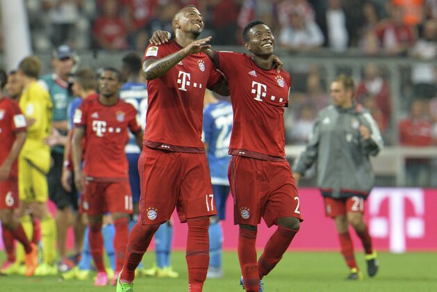 Bayern's Jerome Boateng, and David Alaba smile after winning 5-0 in the German Bundesliga soccer match between FC Bayern Munich and Hamburger SV in Munich, southern Germany, Friday, Aug. 14, 2015. (AP Photo/Kerstin Joensson)