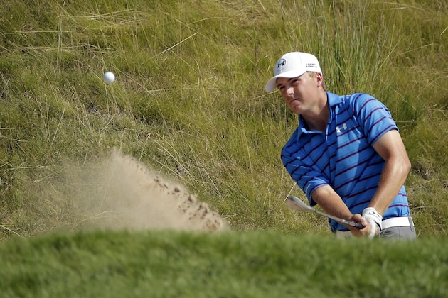 Jordan Spieth hits from a bunker on the 18th hole during the second round of the PGA Championship golf tournament Friday, Aug. 14, 2015, at Whistling Straits in Haven, Wis. Spieth made the shot for a birdie. (AP Photo/Chris Carlson)