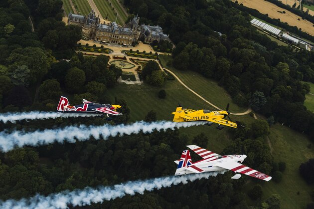 OXFORD, ENGLAND - AUGUST 11: (EDITORIAL USE ONLY)  In this handout photo provided by Red Bull, Nigel Lamb and Paul Bohomme of Great Britain give Peter Besenyei of Hungary an aerial view of their home country ahead of the weekend's Red Bull Air Race World Championship stop in Ascot over the Waddesdon Manor in the heart of the Buckinghamshire countryside near Oxford in the United Kingdom on August 11, 2015.  (Photo by Armin Walcher/Red Bull via Getty Images)