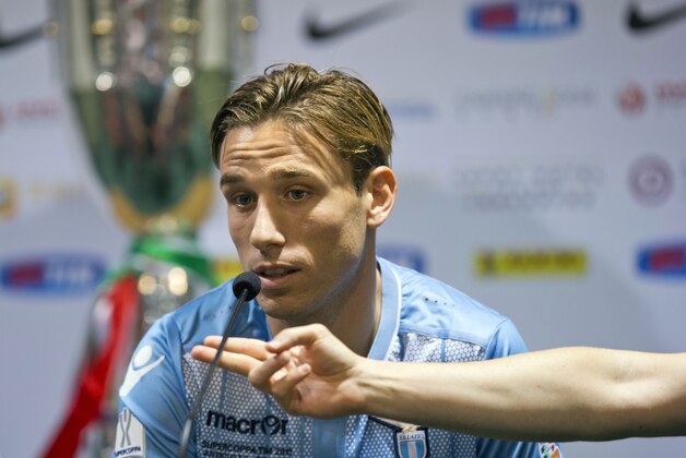 Lazio captain Lucas Biglia attends a press conference ahead of the 2015 TIM Italian Supercup against Juventus held at the Shanghai Stadium in Shanghai, Friday, Aug. 7, 2015. (AP Photo/Ng Han Guan)