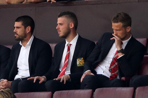 MANCHESTER, ENGLAND - AUGUST 08:  Goalkeepers Victor Valdes and David De Gea of Manchester United watch the game from the stands during the Barclays Premier League match between Manchester United and Tottenham Hotspur at Old Trafford on August 08, 2015 in Manchester, England.  (Photo by Matthew Ashton - AMA/Getty Images)