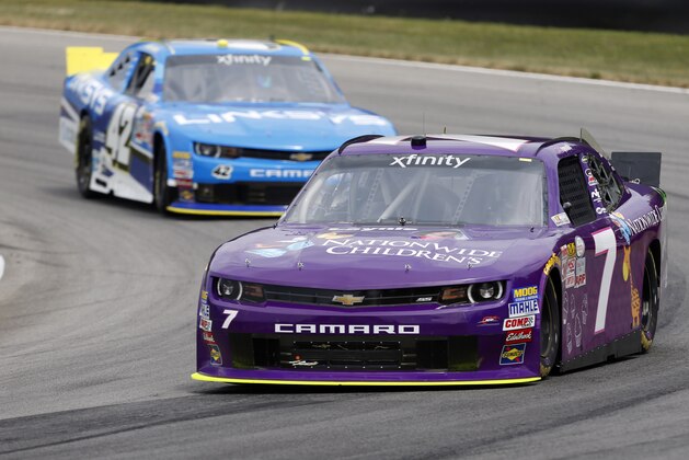 Regan Smith leads Justin Marks through a corner on track during practice for the NASCAR Xfinity Series Nationwide Children's Hospital 200 auto race at Mid-Ohio Sports Car Course Friday, Aug. 14, 2015 in Lexington, Ohio. (AP Photo/Tom E. Puskar)