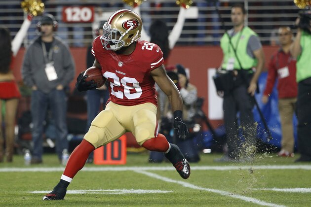 San Francisco 49ers running back Carlos Hyde (28) runs against the Seattle Seahawks during the first quarter of an NFL football game in Santa Clara, Calif., Thursday, Nov. 27, 2014. (AP Photo/Tony Avelar)