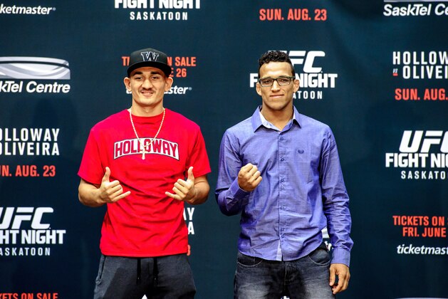 SASKATOON, SK - JUNE 24:  Max Holloway (L) and Charles Oliveira (R) square off for the crowd at a press conference at the SaskTel Centre, June 24,  2015 in Saskatoon, Saskatchewan, Canada.  (Photo by Steve Hiscock/Getty images)