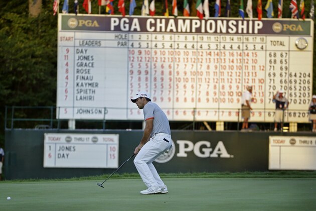 Jason Day, of Australia, reacts to a missed birdie putt on the 18th hole during the third round of the PGA Championship golf tournament Saturday, Aug. 15, 2015, at Whistling Straits in Haven, Wis. (AP Photo/Brynn Anderson)
