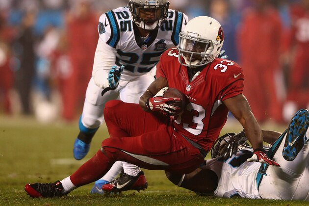 CHARLOTTE, NC - JANUARY 03:  Kerwynn Williams #33 of the Arizona Cardinals runs the ball against the Carolina Panthers in the 2nd half during their NFC Wild Card Playoff game at Bank of America Stadium on January 3, 2015 in Charlotte, North Carolina.  (Photo by Streeter Lecka/Getty Images)