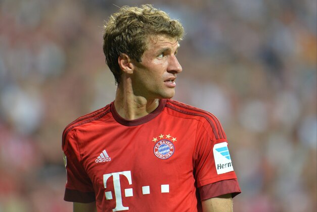 Bayern's Thomas Mueller looks on during the German Bundesliga soccer match between FC Bayern Munich and Hamburger SV in Munich, southern Germany, Friday, Aug. 14, 2015. (AP Photo/Kerstin Joensson)