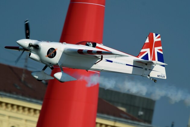 Britain's Paul Bonhomme with his EDGE540 V3 type plane flies during the 2015 Red Bull Air Race World Championship in Budapest on July 5, 2015.  AFP PHOTO / ATTILA KISBENEDEK        (Photo credit should read ATTILA KISBENEDEK/AFP/Getty Images)