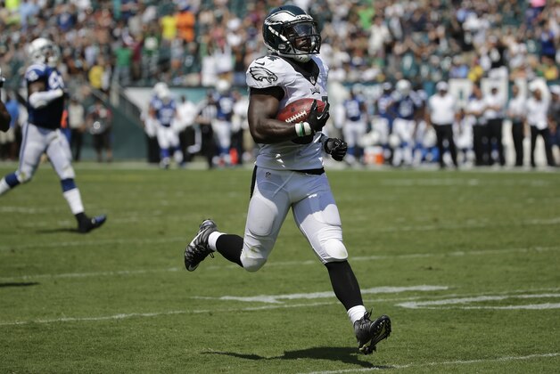 Philadelphia Eagles' Kenjon Barner (34) returns a punt for a touchdown during the first half of a preseason NFL football game against the Indianapolis Colts, Sunday, Aug. 16, 2015, in Philadelphia. (AP Photo/Michael Perez)