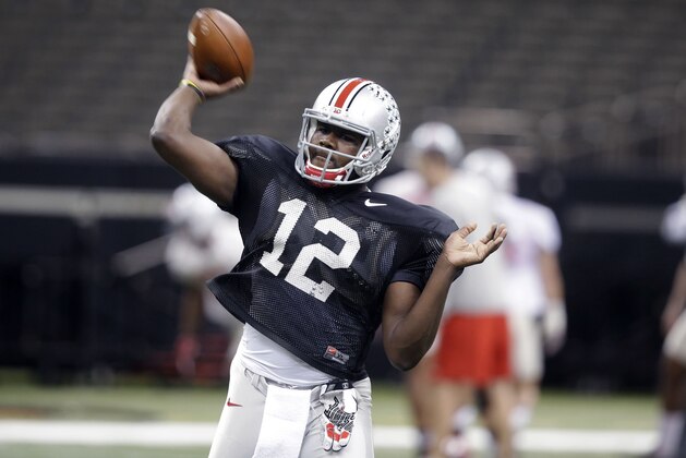 Ohio State quarterback Cardale Jones (12) passes during practice at the Mercedes-Benz Superdome in New Orleans, Monday, Dec. 29, 2014. They will square off against Alabama in the Allstate Sugar Bowl NCAA football game, which will be played Jan. 1, 2015. (AP Photo/Gerald Herbert)