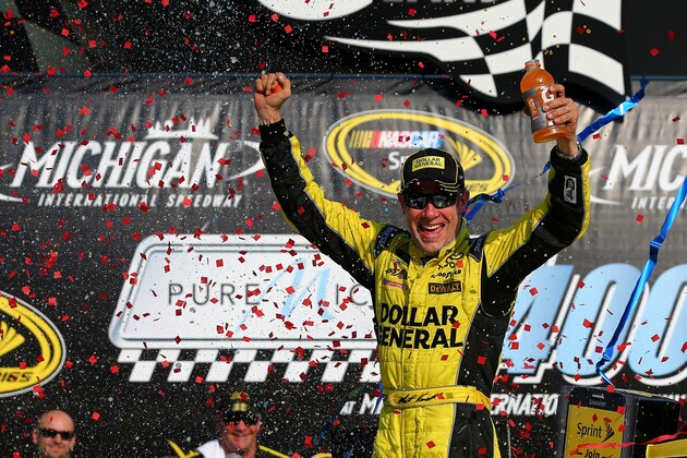 BROOKLYN, MI - AUGUST 16:  Matt Kenseth, driver of the #20 Dollar General Toyota, celebrates in victory lane after winning the NASCAR Sprint Cup Series Pure Michigan 400 at Michigan International Speedway on August 16, 2015 in Brooklyn, Michigan.  (Photo by Sarah Crabill/Getty Images)