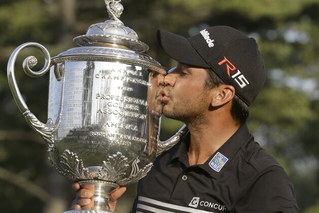 Jason Day, of Australia, kisses the Wanamaker Trophy after winning the PGA Championship golf tournament Sunday, Aug. 16, 2015, at Whistling Straits in Haven, Wis.(AP Photo/Brynn Anderson)