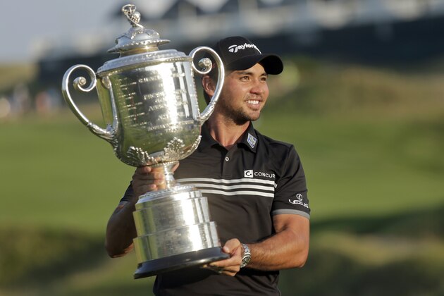 Jason Day, of Australia, holds up the Wanamaker Trophy after winning the PGA Championship golf tournament Sunday, Aug. 16, 2015, at Whistling Straits in Haven, Wis. (AP Photo/Chris Carlson)