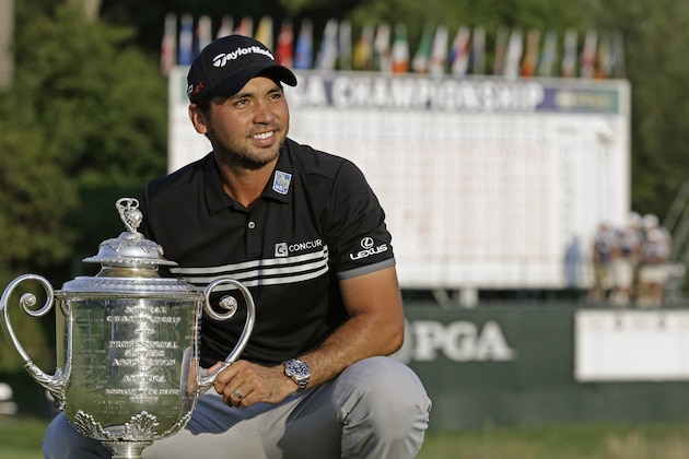 Jason Day, of Australia, posses with the Wanamaker Trophy after winning the PGA Championship golf tournament Sunday, Aug. 16, 2015, at Whistling Straits in Haven, Wis. (AP Photo/Brynn Anderson)