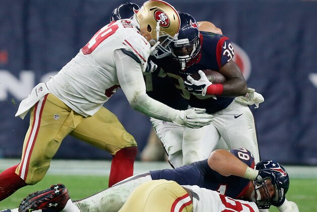 HOUSTON, TX - AUGUST 15:  Kenny Hilliard #38 of the Houston Texans is tackled by Arik Armstead #69 of the San Francisco 49ers at Reliant Arena at Reliant Park on August 15, 2015 in Houston, Texas.  (Photo by Bob Levey/Getty Images)